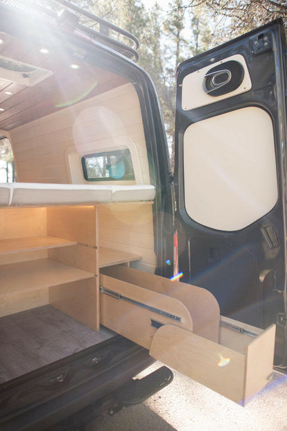 Custom shelving and pull-out drawers are available for the garage space underneath the bed.